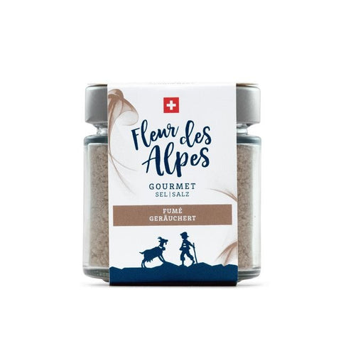 Ein Glas „Fleur des Alpes Gourmet“ geräuchertes Salz mit einem Schweizer Kreuz auf dem Etikett.