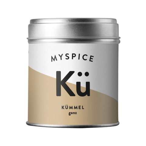 Eine Dose von MYSPICE mit der Aufschrift "Kümmel ganz" auf beigefarbenem und weißem Etikett.