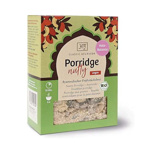 Verpackung von "Classic Ayurveda Porridge nutty" (Ayurvedischer Frühstücksbrei), vegan und bio-zertifiziert, mit dem Hinweis "Vata-Balance".