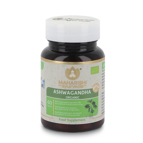 Eine Dose Maharishi Ayurveda Ashwagandha Bio-Nahrungsergänzungsmittel mit 60 Tabletten. Die dunkle Glasflasche hat ein grün-weißes Etikett mit dem Bio-Siegel.