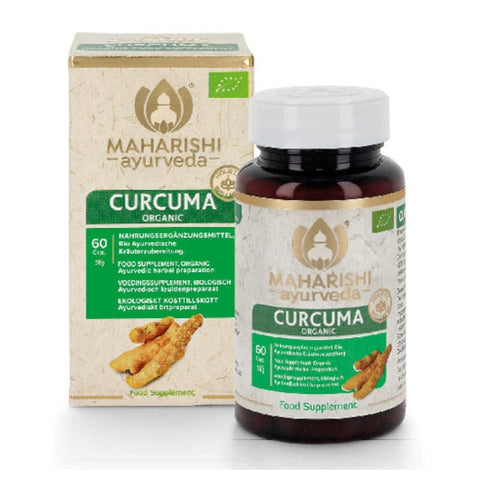 Eine Braunglasflasche und der dazugehörige Umkarton für das Bio-Nahrungsergänzungsmittel „Curcuma“ von Maharishi Ayurveda, mit grünem Etikett, einer Abbildung von Kurkuma-Wurzeln und einem Bio-Siegel.