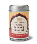 Eine silberne Metalldose von „Classic Ayurveda“ Kalonji (Schwarzkümmel), mit einem creme-roten Etikett im Bogen-Design und einem grünen Bio-Siegel.