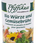 Eine weiße, zylindrische Dose „Pfiffikuss Bio Würze und Gemüsebrühe“ mit weißem Deckel und bunten Illustrationen von frischem Gemüse und einer Sonnenblume am unteren Rand.