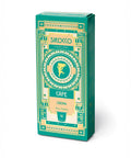 Eine petrolfarbene und goldene Schachtel Sirocco „Cafe Crema“ Kapseln im Art-déco-Stil mit 10 „Pure Arabica“-Kapseln.