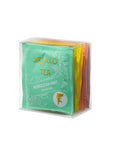 Eine durchsichtige, würfelförmige Box mit der Sirocco Tea Fruit and Herbal Selection, die verschiedene Farben von Teebeutel-Verpackungen enthält, wobei die türkise Packung für Moroccan Mint Herbal Tea im Vordergrund steht.