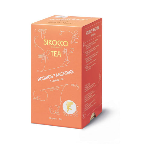 Eine orangefarbene Schachtel Sirocco „Rooibos Tangerine“ Bio-Kräutertee mit eleganten goldenen Schnörkeln und einer Seitenwand mit Zutatenlisten in mehreren Sprachen.