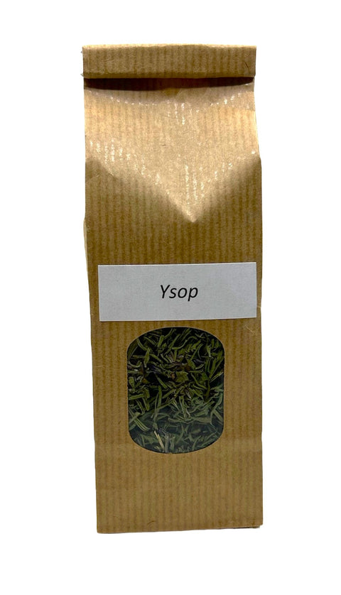 Ein vertikaler brauner Papierbeutel mit einem kleinen ovalen Sichtfenster, das getrocknetes grünes Ysopkraut zeigt, versehen mit einem weißen rechteckigen Etikett mit der Aufschrift „Ysop“.